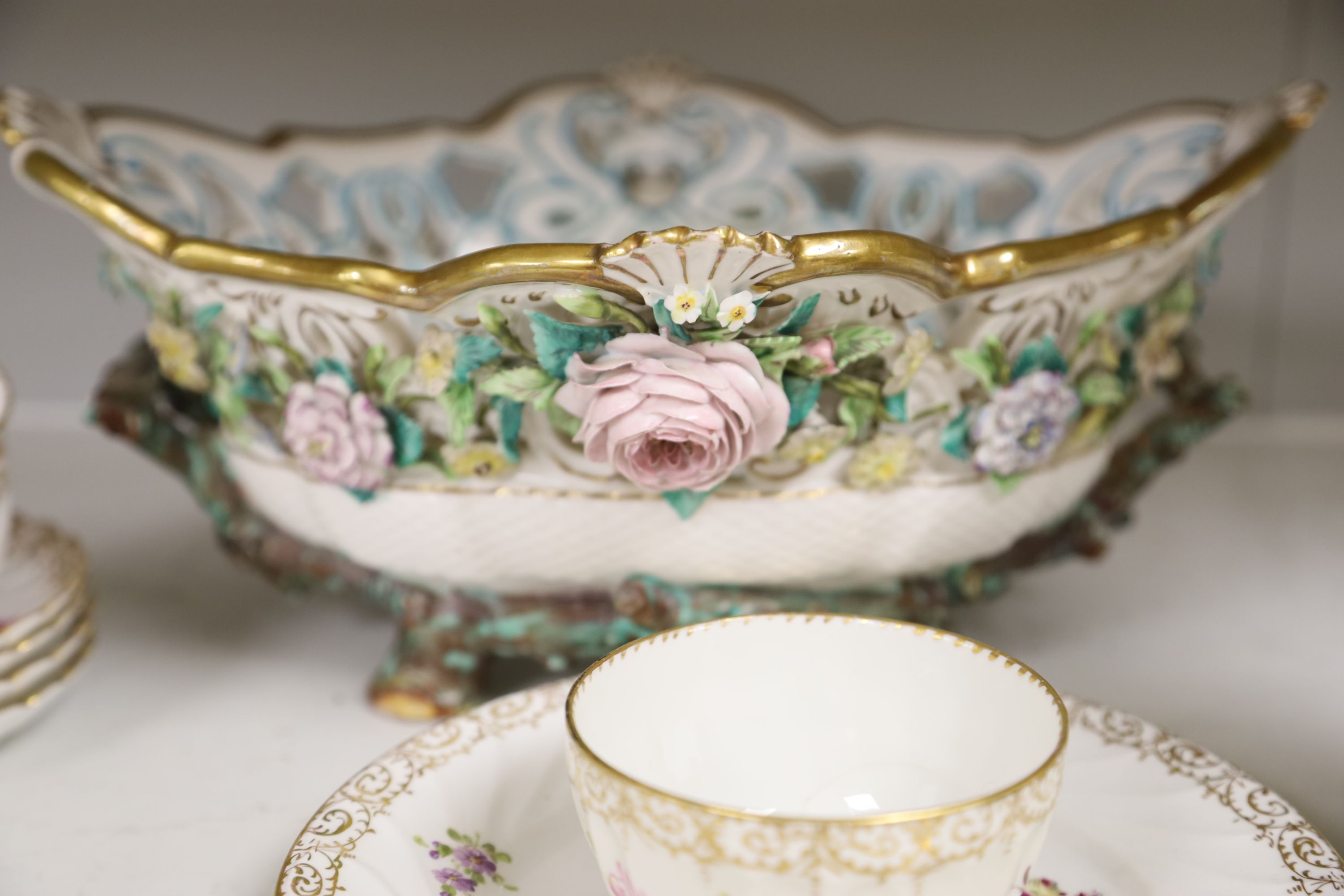 A Dresden-style pierced oval flower-encrusted bowl with branch feet and handles and a Dresden part tea service (15-pce)